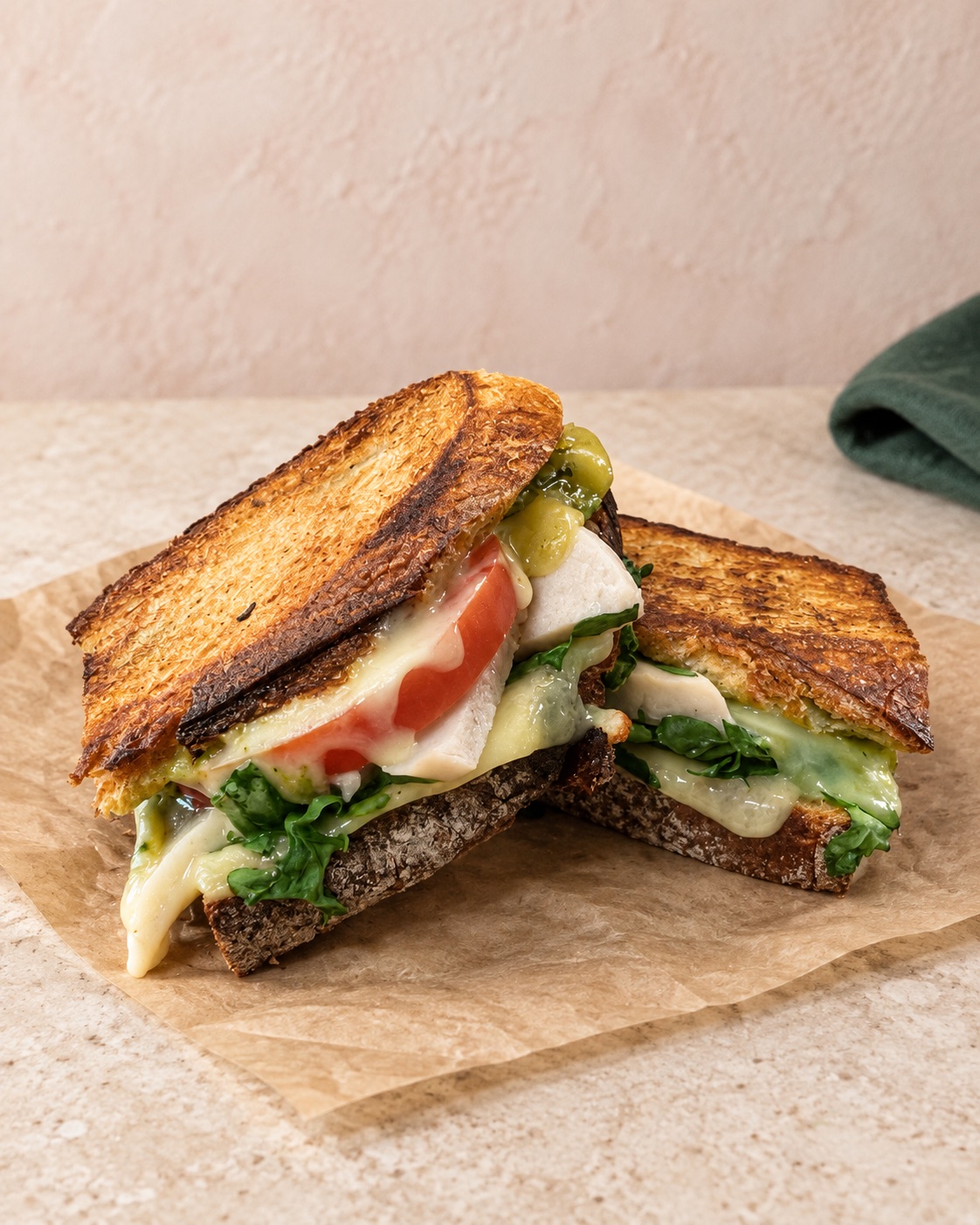Toasted gourmet sandwich with greens and cheese